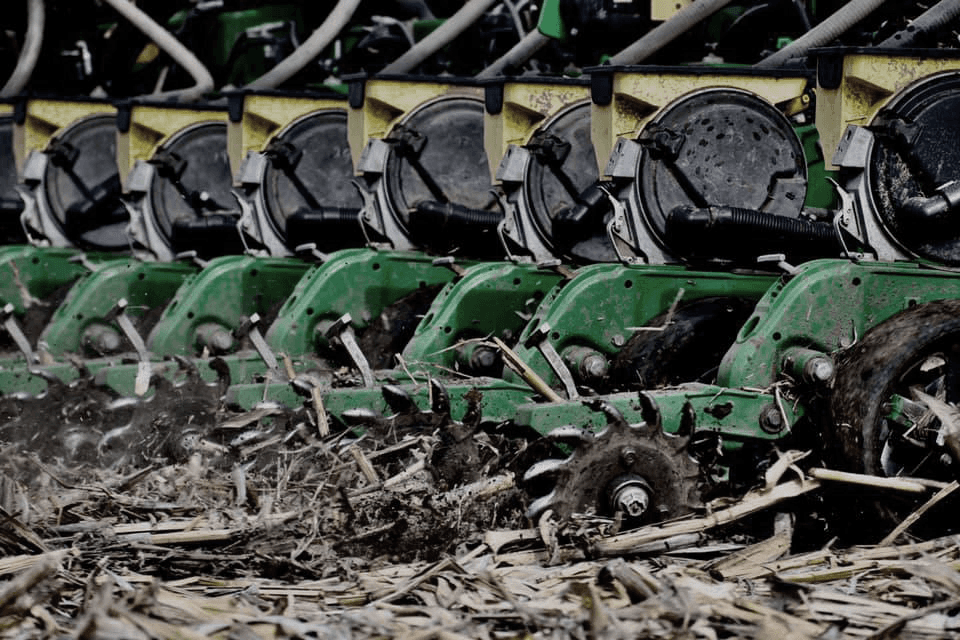 Planter row units cutting through heavy corn residue
